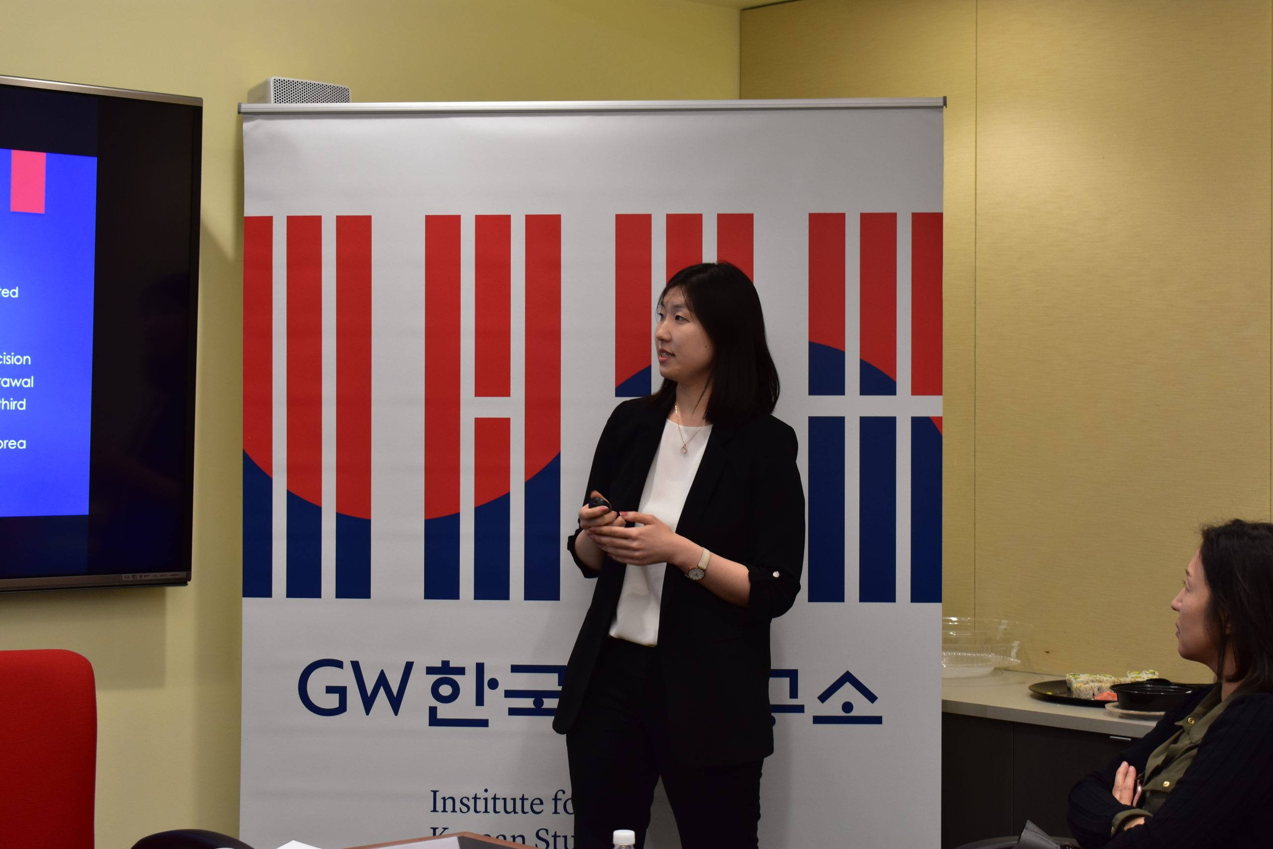 Angela Kim presenting during event