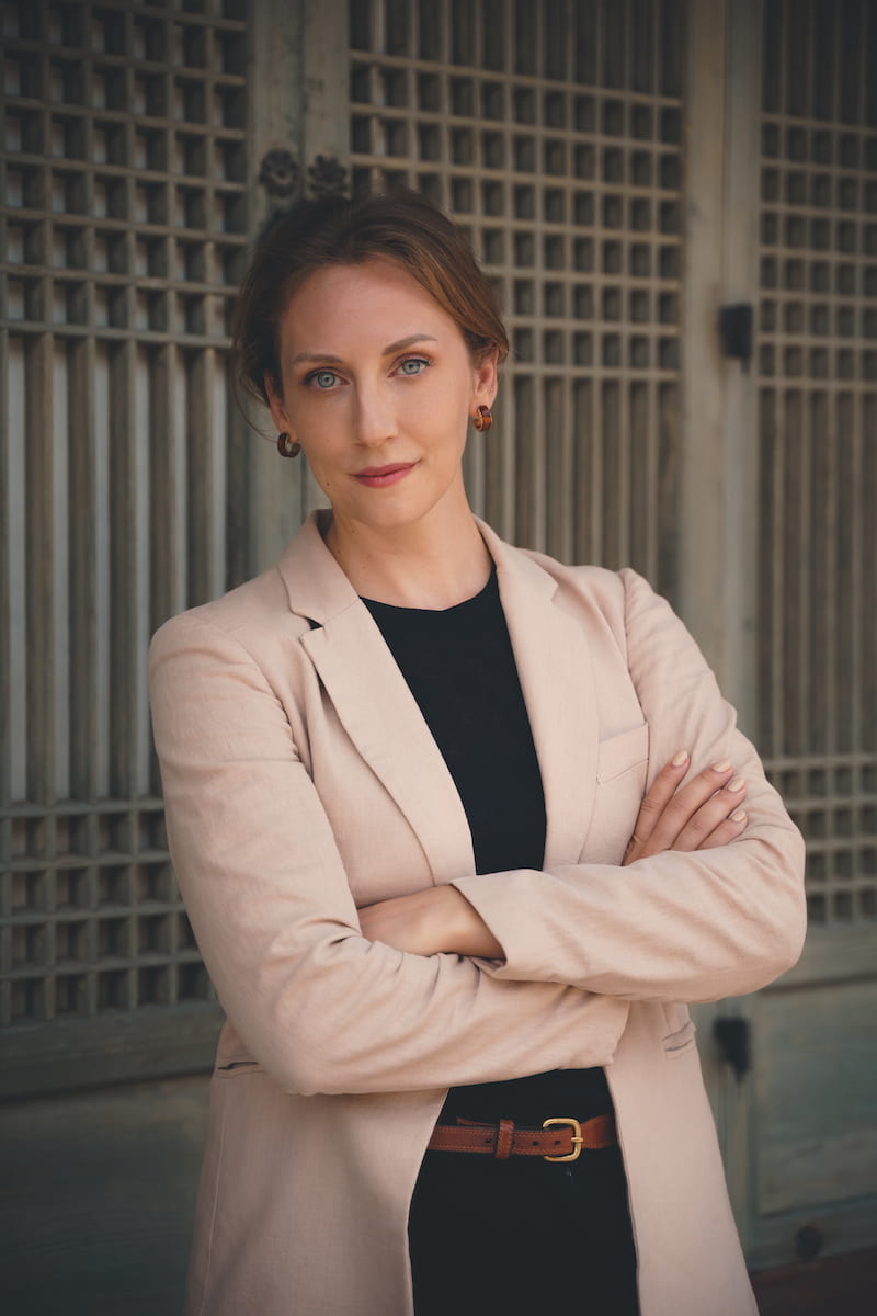 portrait of Darcie Draudt in professional attire posing with arms crossed