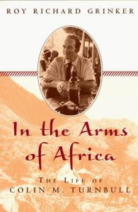 yellow and white book cover with photo of an anthropologist; text: In the Arms of Africa by Roy Richard Grinker