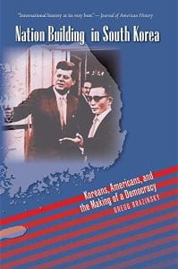 blue book cover with red stripes and photo of John F Kennedy with Korean officials; text: Nation Building in South Korea: Koreans, Americans, and the Making of a Democracy by Gregg Brazinsky
