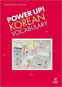 red book cover with image in the center labeled with korean vocabulary; text: Power Up! Korean Vocabulary by Insung Ko and Sang Seok Yoon