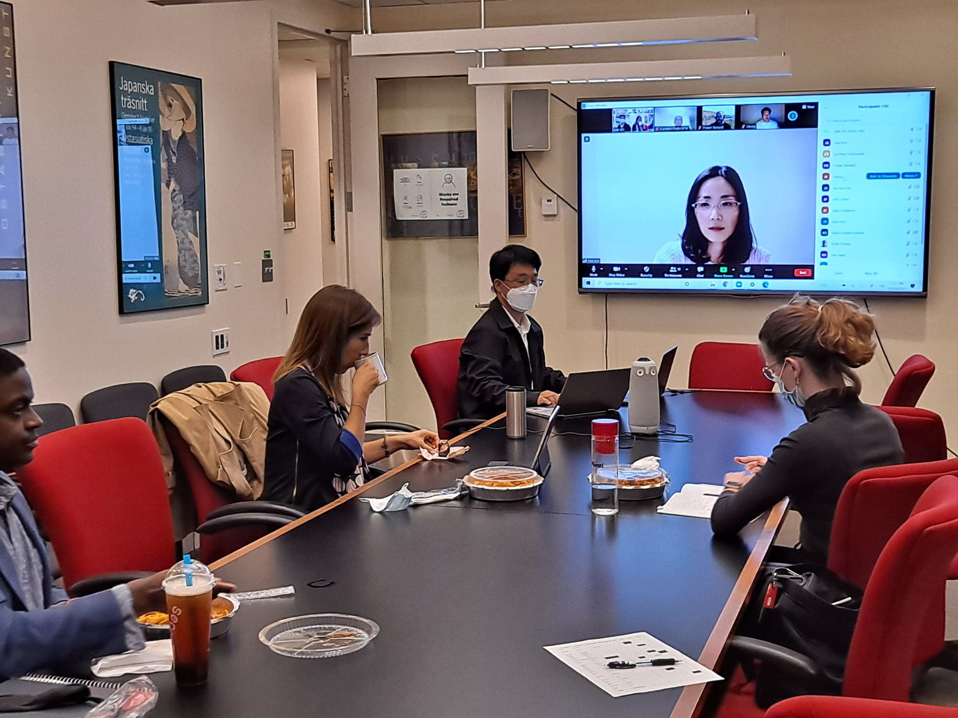 participants of the 2021 GWIKS North Korea Program sitting around a table in a conference room
