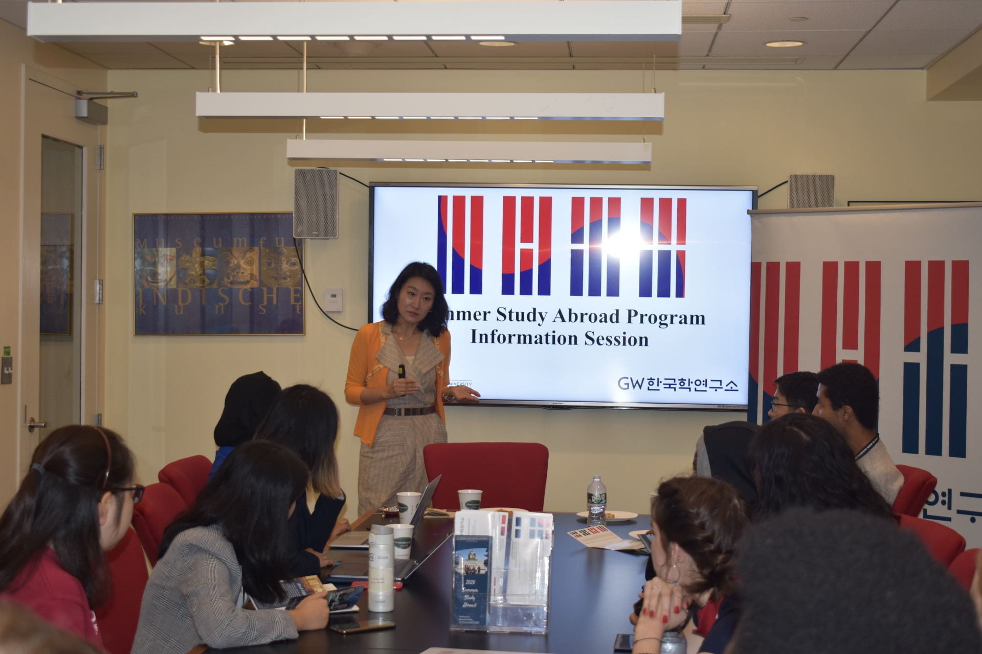 Professor Jisoo Kim speaking to students at an info session