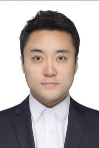 portrait of Hyun-woo Kim with white background