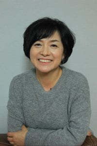 portrait of Nanhee Ku in grey shirt