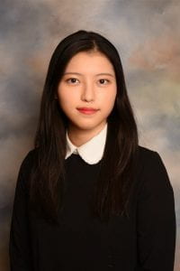 portrait of Soeun Lee in black shirt smiling at the camera