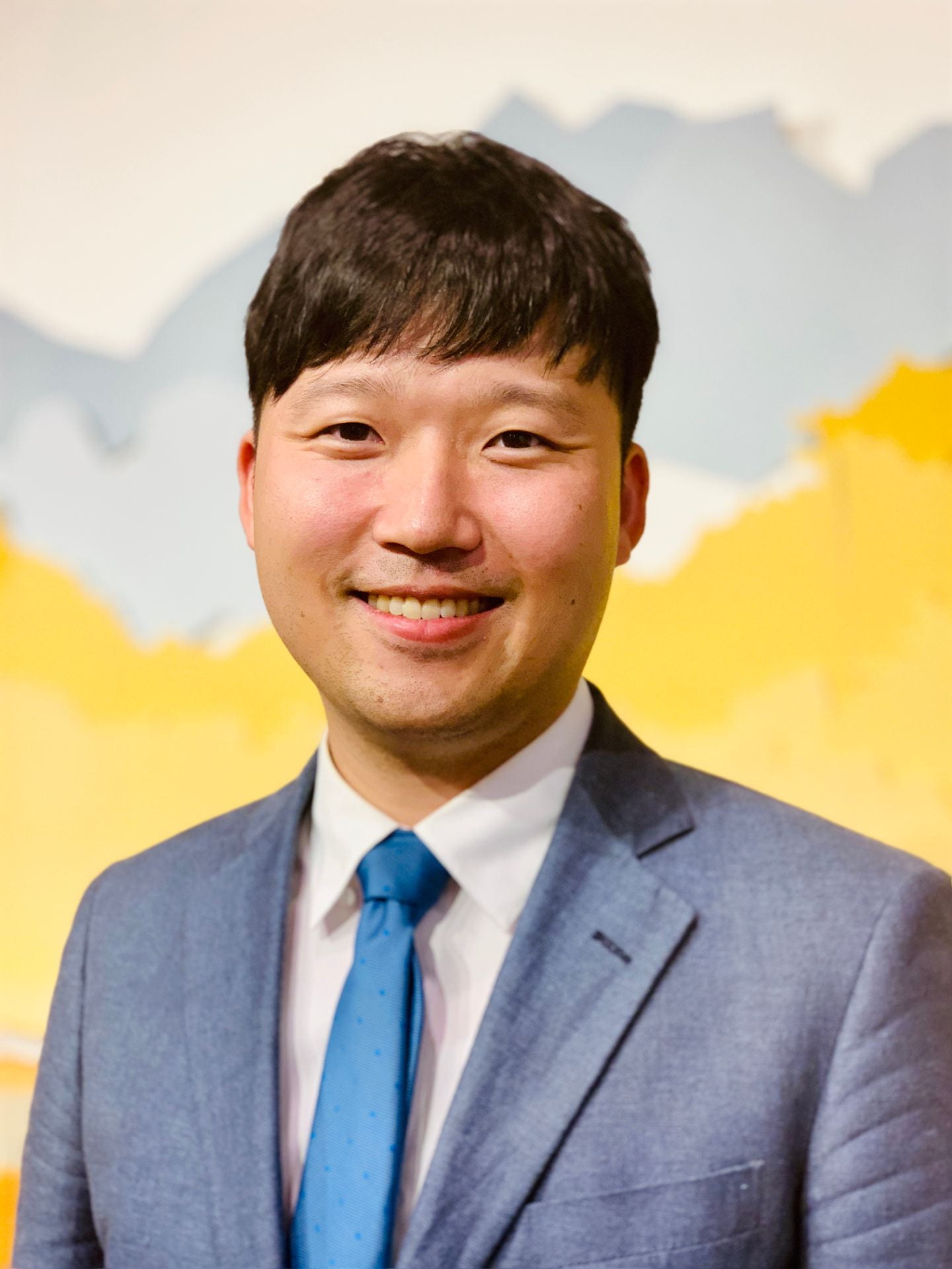 portrait of Hyungsok "Nathan" Choe in professional attire